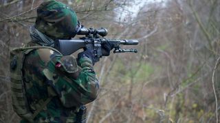 Photo by Kony Xyzx: https://www.pexels.com/photo/man-in-camouflage-army-uniform-holding-rifle-3706709/